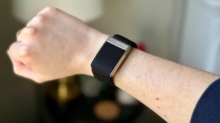 Close-up of the Whoop 5.0 Strap on a person’s wrist tracking fitness and sleep data